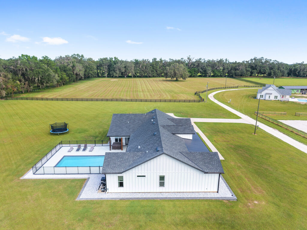 Aerial view of home with pool